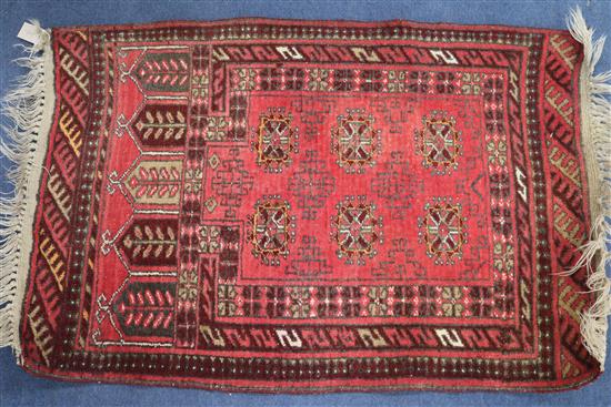 A Tekke style red ground mat, 110cm x 72cm